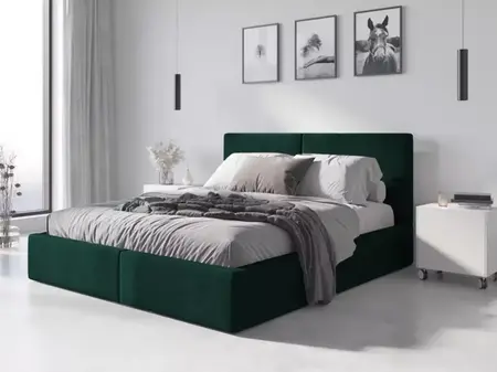 Łóżko z zieloną tapicerką